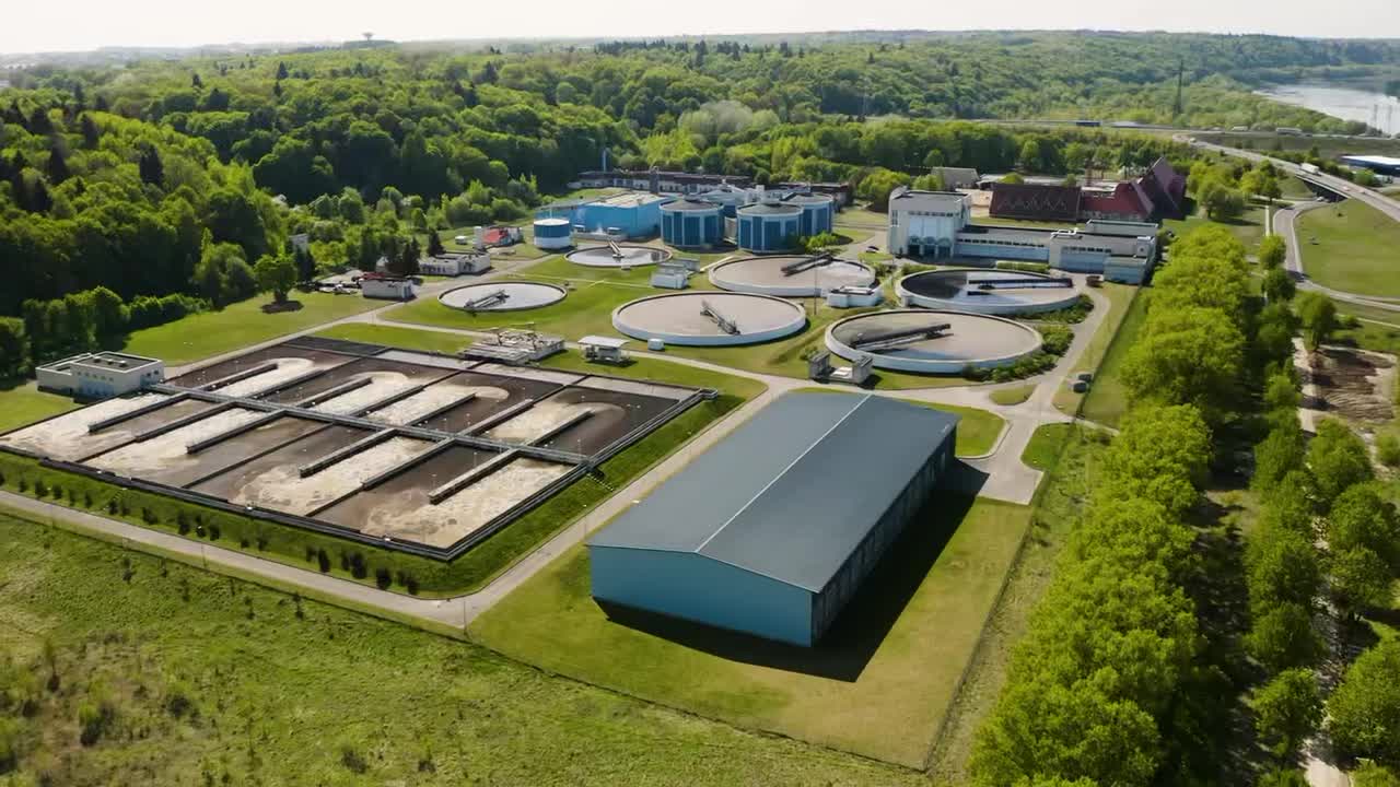 A treatment plant nestled in forest beside the river it protects